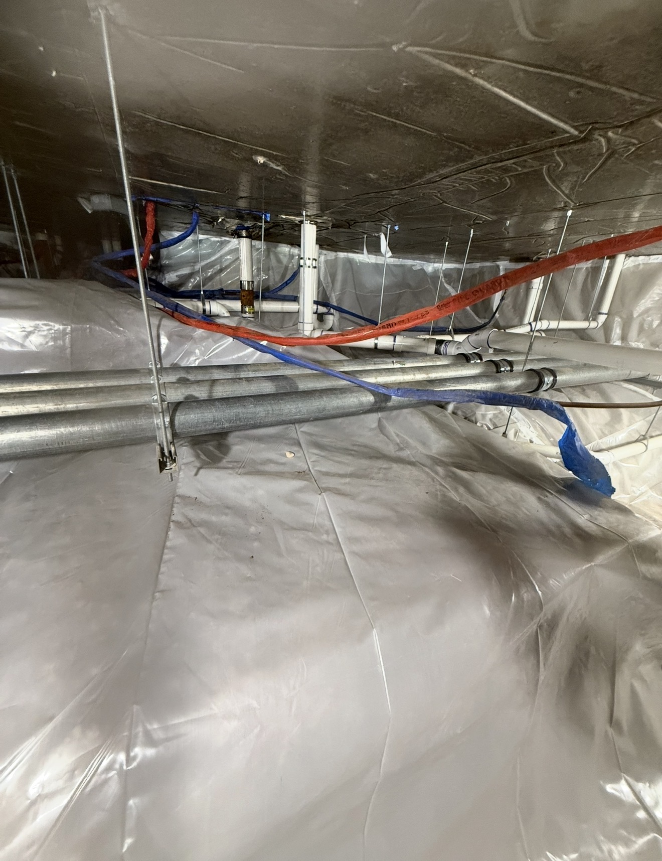 Foil and poly wrapped crawl space ceiling containment with utilities sealed off